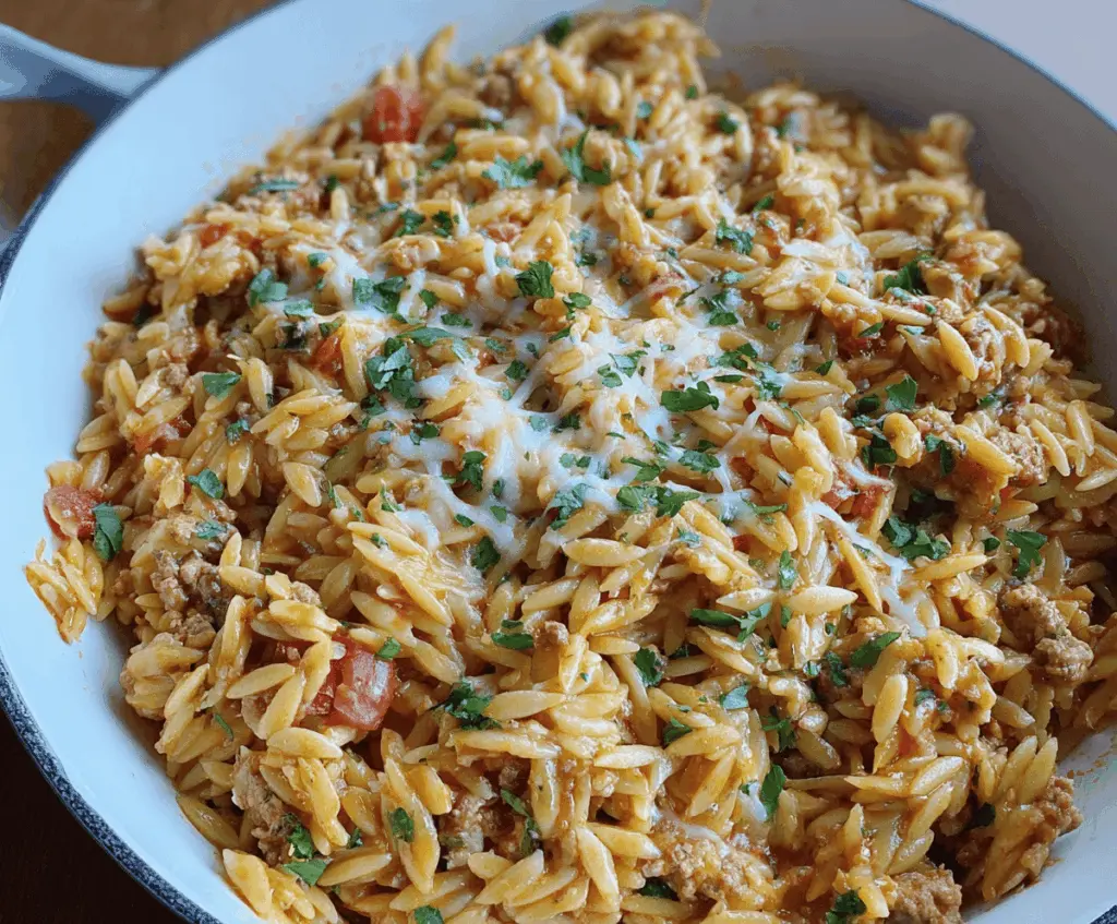 Delicious homemade ground turkey orzo pasta dish garnished with fresh herbs, perfect for a healthy and flavorful meal