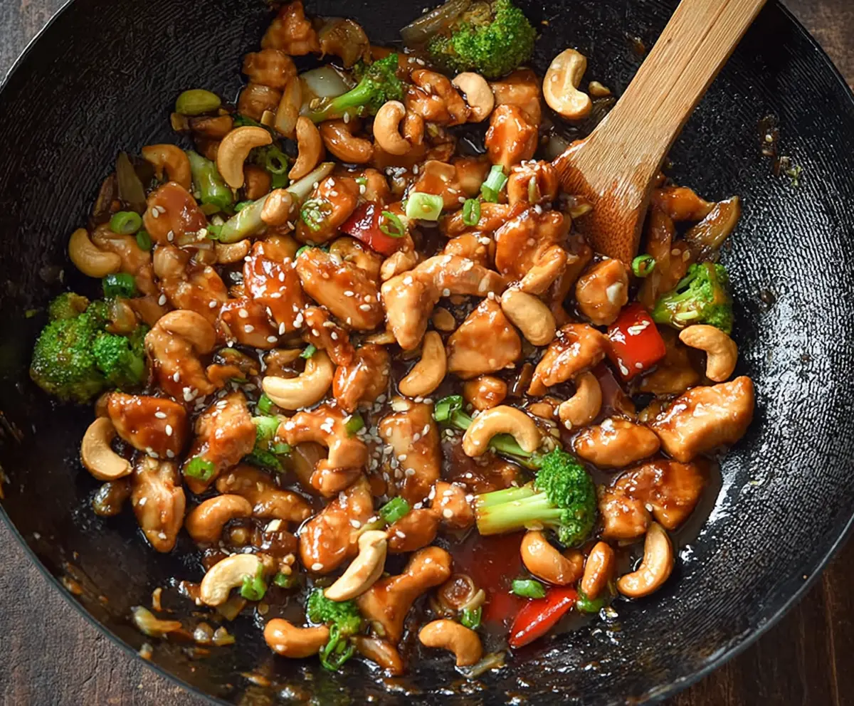 Delicious easy authentic cashew chicken served in a bowl with fresh vegetables.
